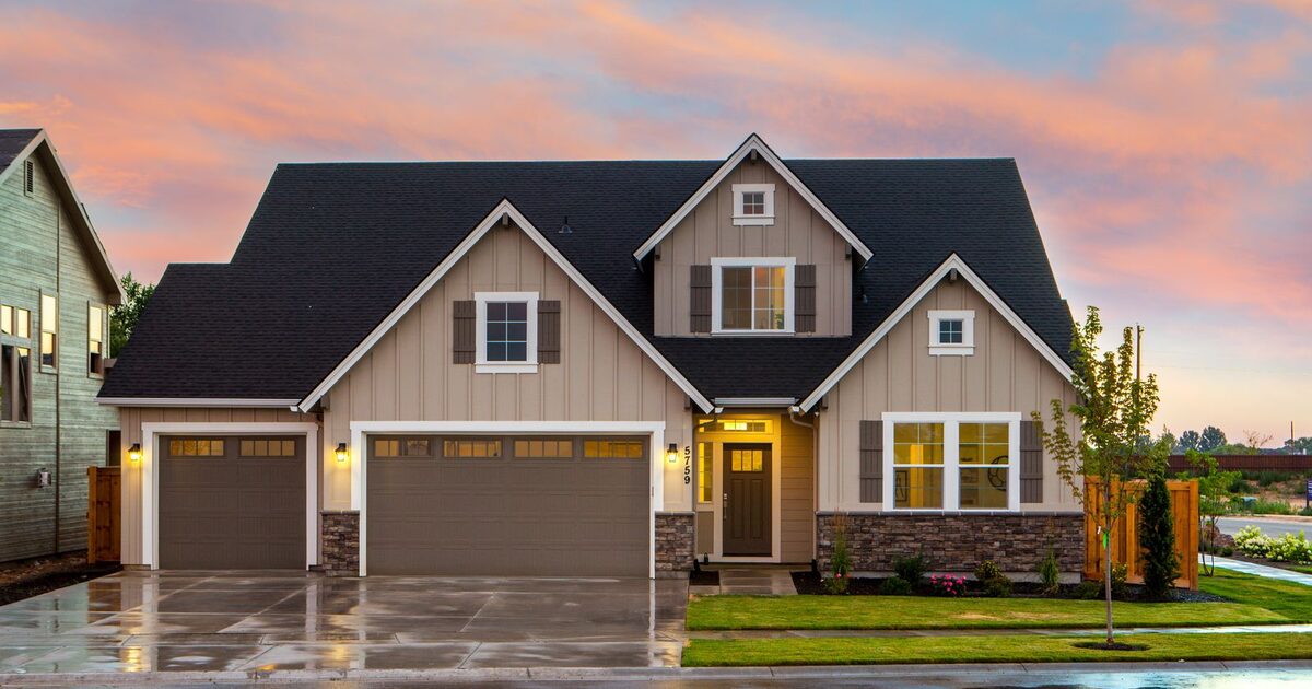 A well-maintained suburban home exterior at dusk, the kind of property a maintenance report profiles
